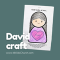 Children's craft activity sheet with a drawing of a girl and a heart, on a green background.