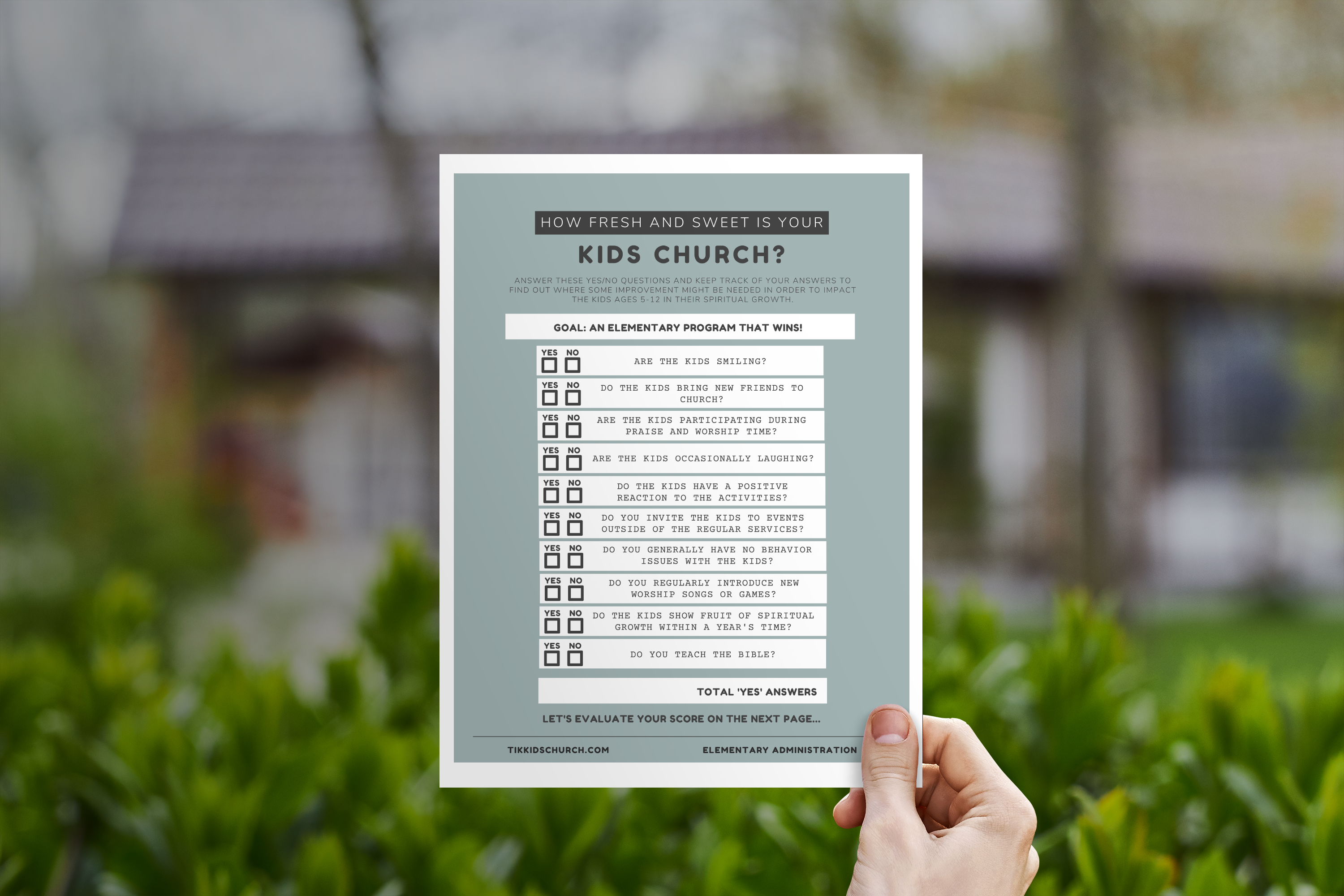Hand holding a paper with a checklist against a blurred outdoor background