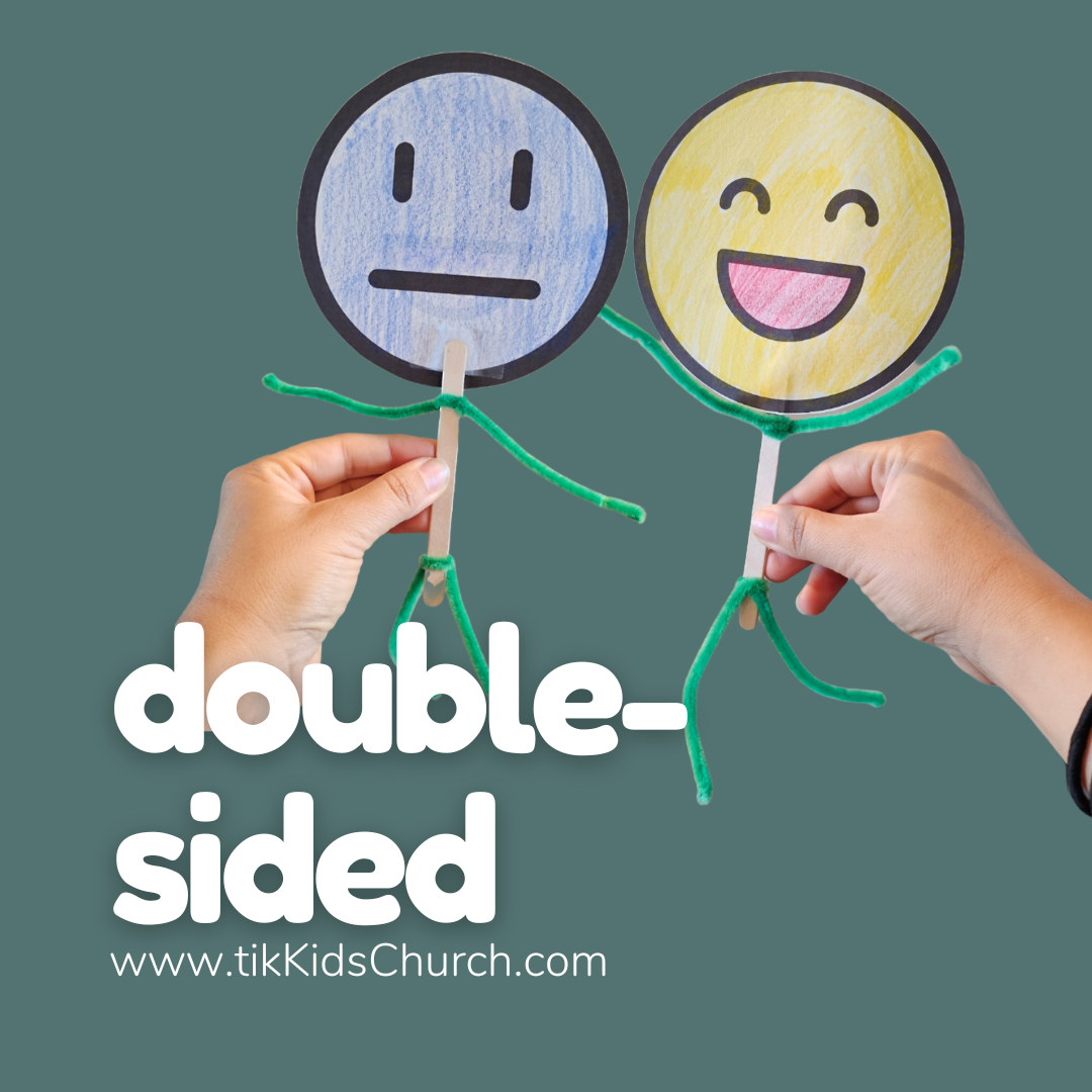 Two hands holding up two smiley face cutouts with the text 'double-sided' and a website URL.